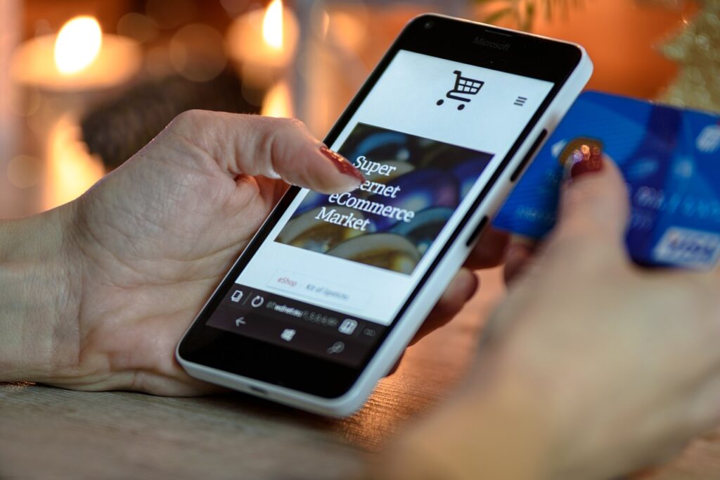 A woman uses her credit card to shop online.